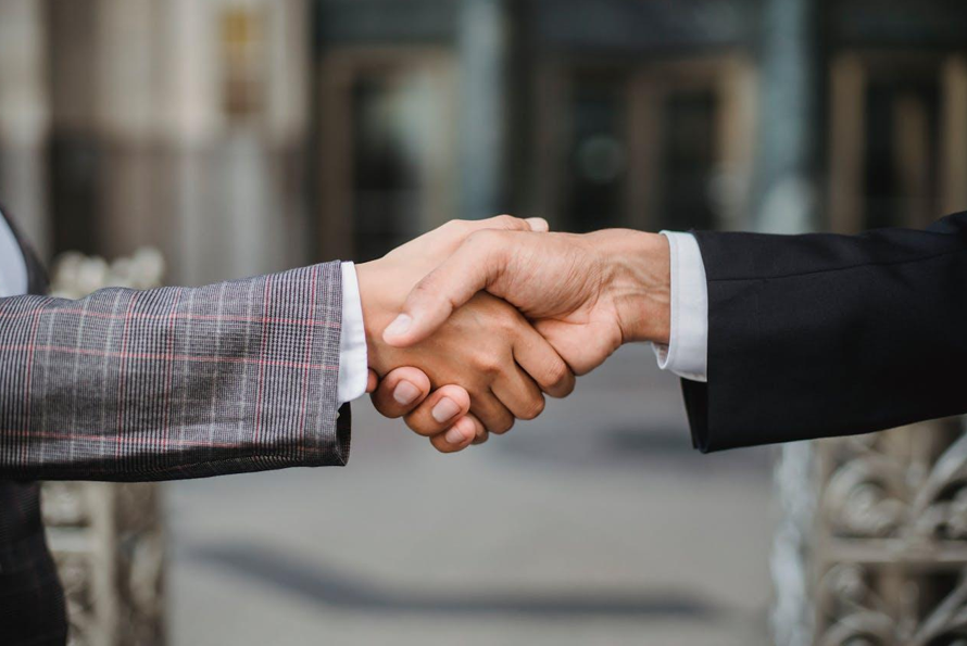 Two People Shaking Hands